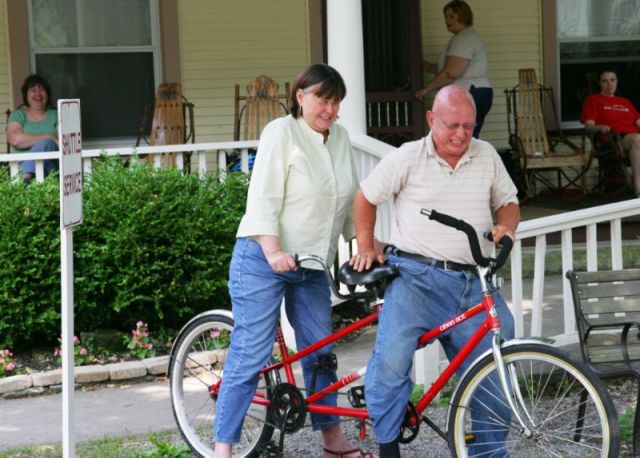 Darlene and John fail to ride a tandem bike